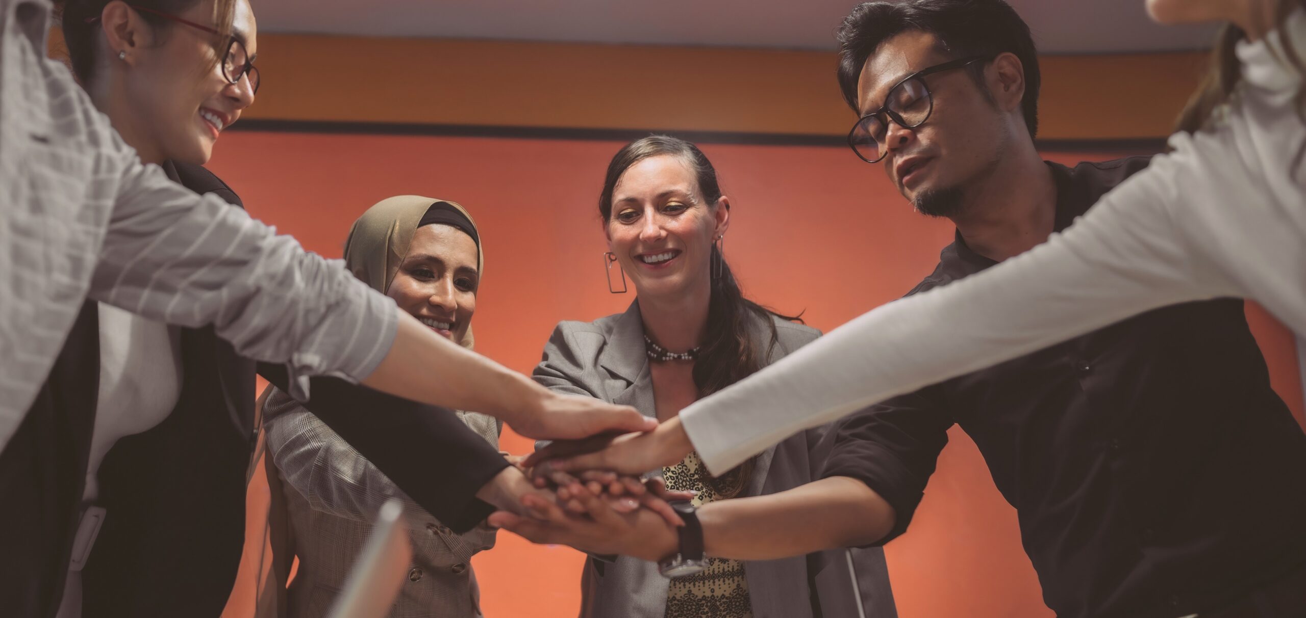 Image of cheerful employees, working together in collaborative, respectful and inclusive organization.